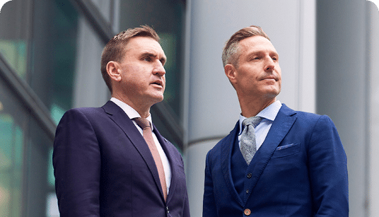 Two attorneys engaged in a discussion | Personal injury law attorney.
