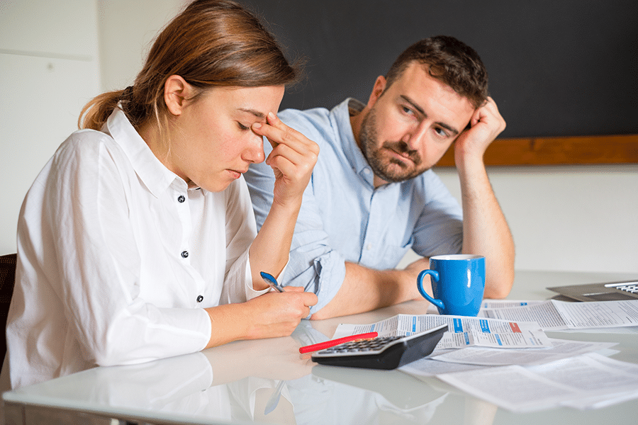 A couple reviewing their finances together.