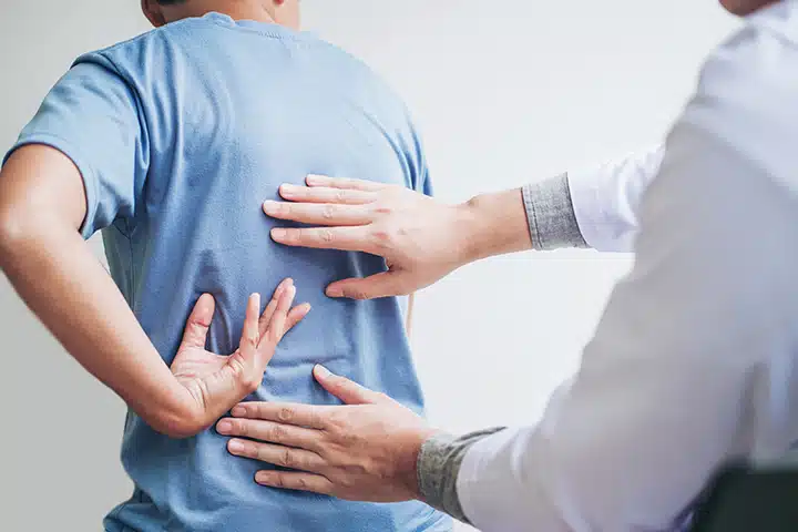 A doctors preforms a medical examination on a patient.